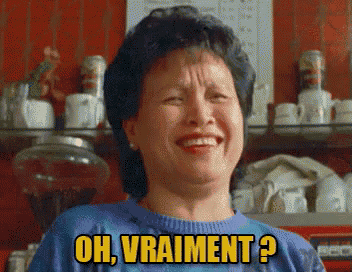 a woman in a blue sweater says " oh vraiment " in yellow