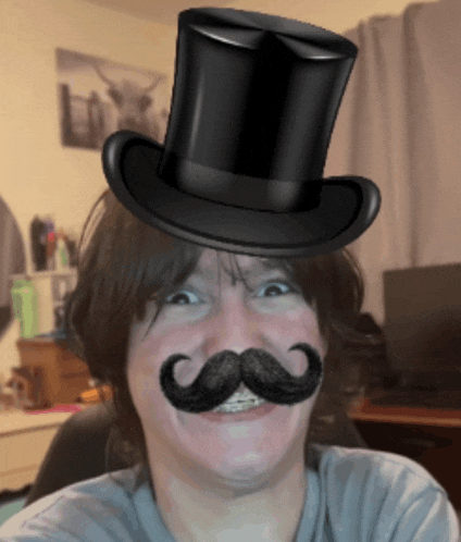 a man with a top hat and mustache on his head