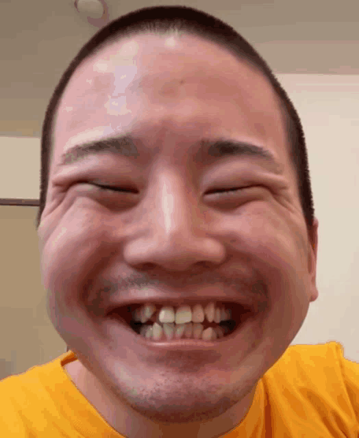 a close up of a man 's face with his eyes closed and his mouth open