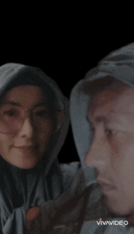 a woman wearing glasses and a hijab says waalaikum salam warahmatullahi wabanakatuh