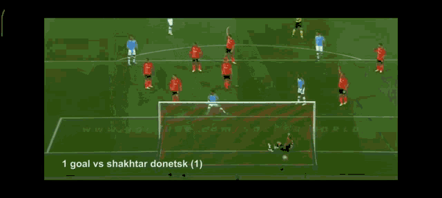 a soccer game is being played and the goal is 1 goal