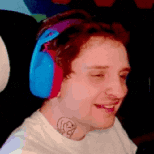 a man wearing headphones and a tattoo on his neck
