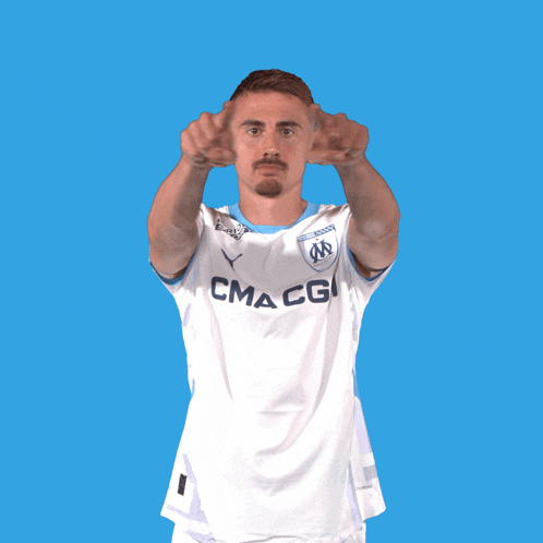 a man wearing a white shirt that says cmacgi