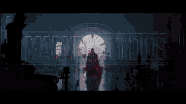 a man in a red cloak is standing in a dark room with red lights coming out of the doorway .
