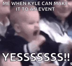 a baby is crying while being held by a person and a meme is being made .