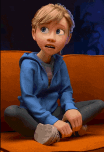 a girl in a blue jacket sits on a couch with her legs crossed