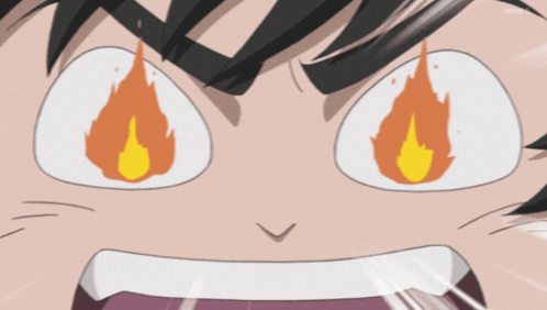a close up of a person 's face with flames in his eyes