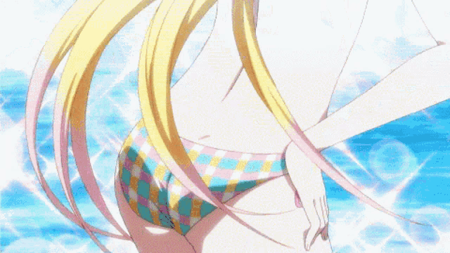 a girl with blonde hair and blue eyes is wearing a pink and yellow plaid bikini