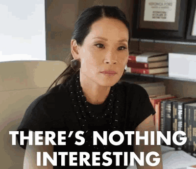 a woman is sitting in a chair and making a funny face with the words `` there 's nothing interesting ''