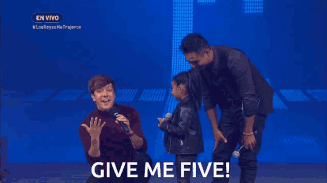 a little girl singing into a microphone with the words give me five on the screen