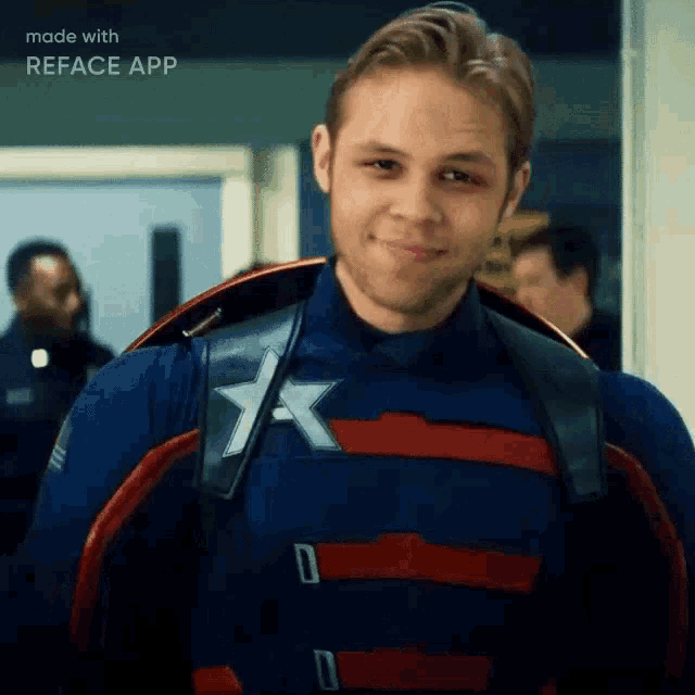 a man in a captain america costume is smiling in a hallway .