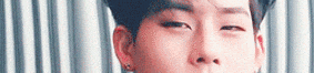 a close up of a young man 's face with his eyes closed and his nose visible .