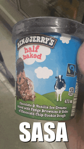 someone is holding a half baked ben & jerry 's ice cream in their hand