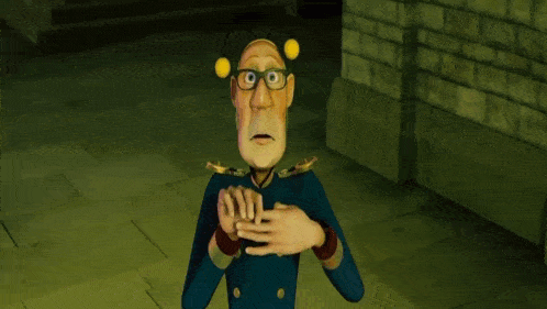 a man in a suit and tie is making a gesture with his hands
