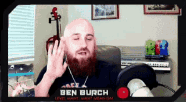 a bald man with a beard is talking into a microphone with the name ben burch on the screen