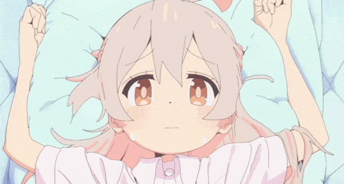 a little girl with white hair and pink eyes is laying on a bed