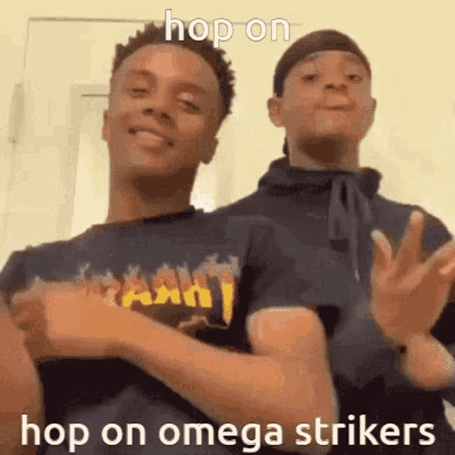 two young men are standing next to each other and making funny faces .