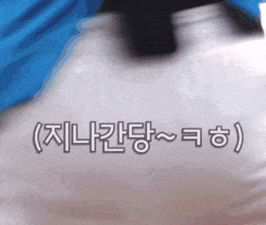 a close up of a person holding a bottle with foreign writing on it