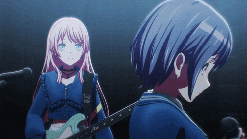 a girl with a guitar strap that says esp is standing next to another girl