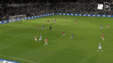 a soccer game is being played on a field with an advertisement for jm logistics