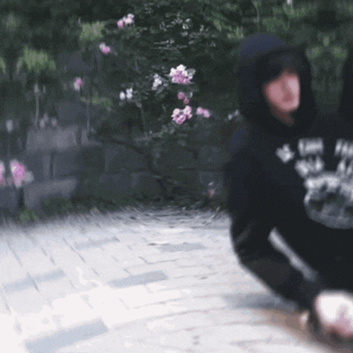 a blurry picture of a person wearing a black hoodie that says i love you