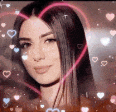 a close up of a woman 's face with hearts surrounding it .