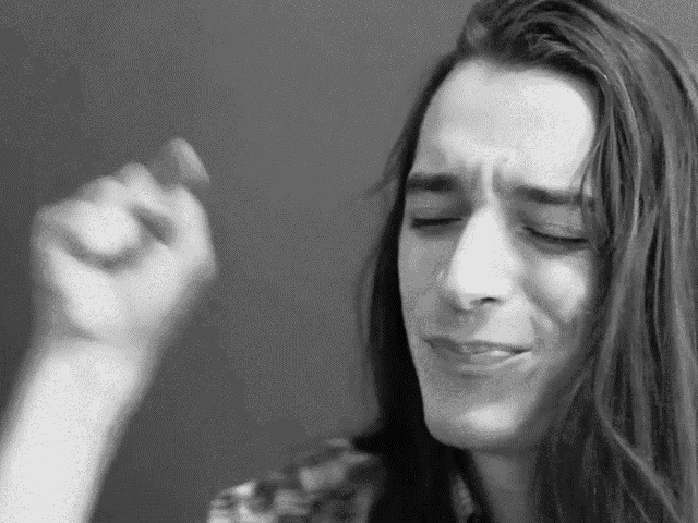 a black and white photo of a woman with long hair