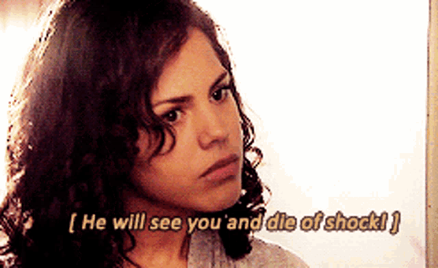 a woman with curly hair is saying he will see you and die of shock