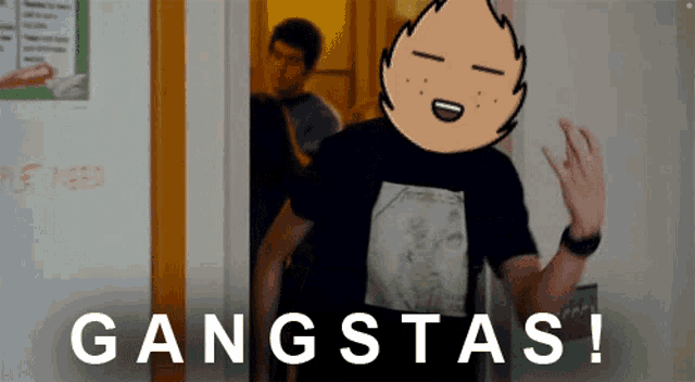a man in a black shirt is standing in front of a wall that says gangsta 's on it