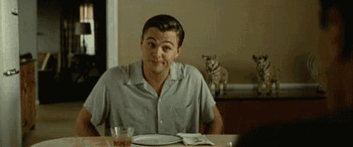 Leo Shrug GIF