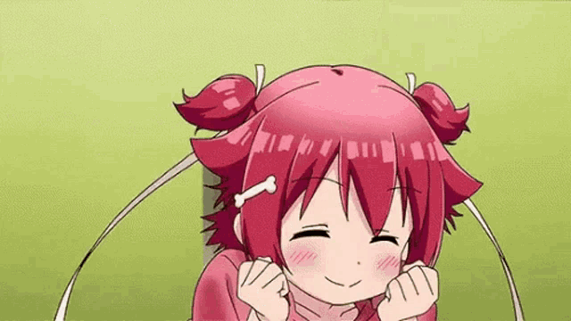 a cartoon girl with red hair and a bone in her hair is smiling with her hands on her face .