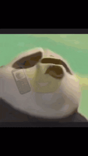 a close up of a cartoon sloth 's face with sunglasses on .