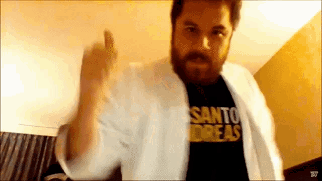 a man is wearing a shirt that says santo andreas on it