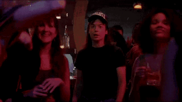 a group of people are dancing and the word schwing is visible