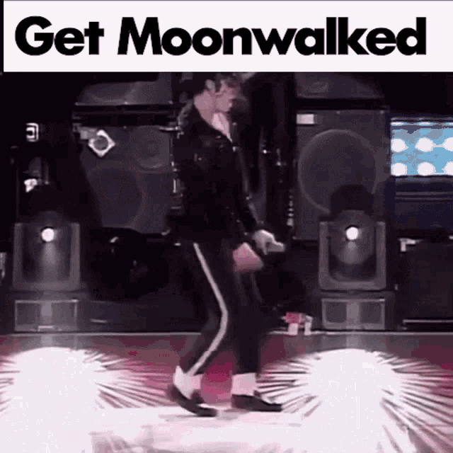 a man is dancing on a stage with a sign that says get moonwalked .