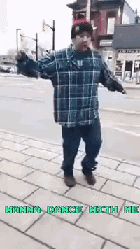a man in a plaid shirt is dancing on a sidewalk with the words hanna dance with me above him