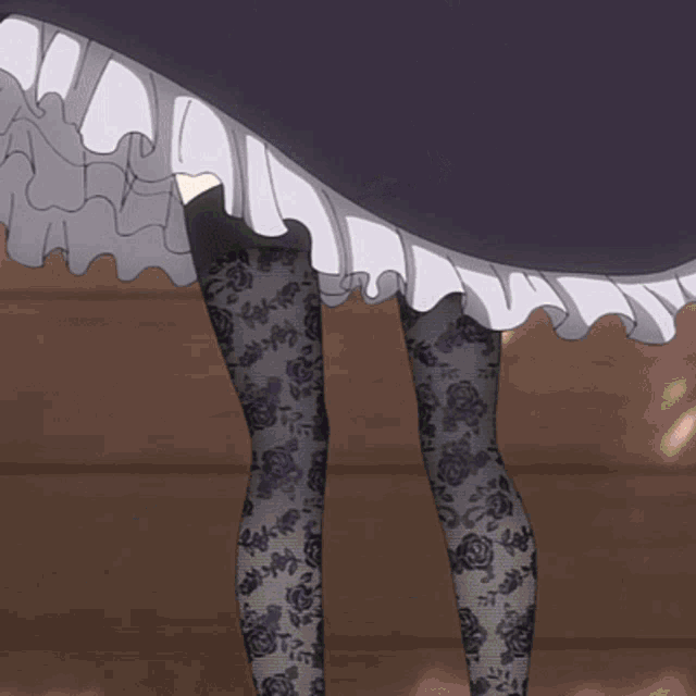 a woman 's legs are shown with stockings and shorts