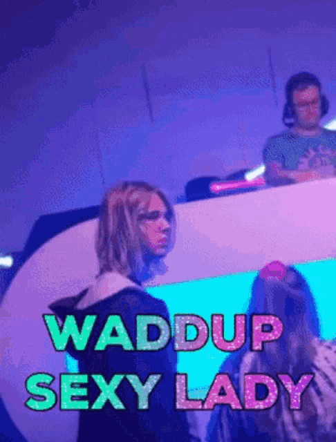 a poster that says waddup sexy lady with a woman standing in front of a dj