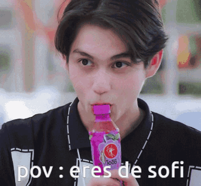 a young man drinking from a purple bottle with the words pov : eres de sofi below him