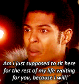 a man is sitting in front of a red light and says " am i just supposed to sit here "