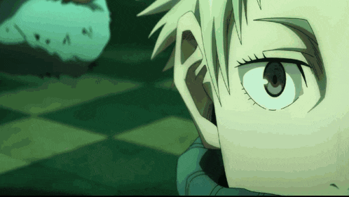 a close up of a person 's face with a chess board in the background