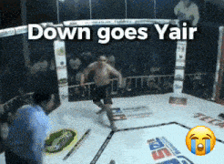 a man in a boxing ring with the words " down goes yair " above him