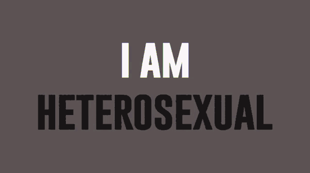 a sign that says " i am homosexual " with a rainbow of colors