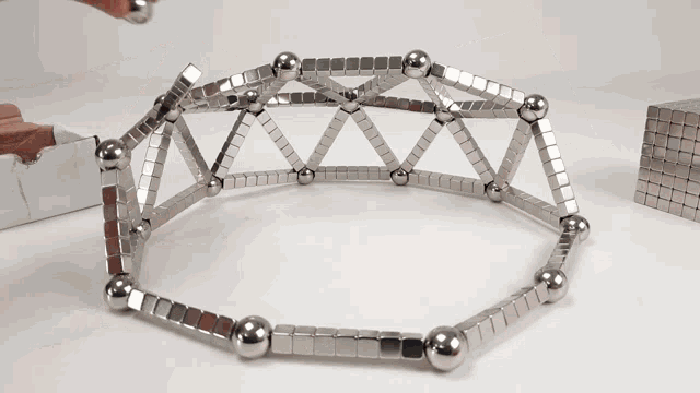 a person is playing with a set of magnets