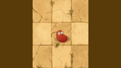 a red bean with a face is floating in the air .