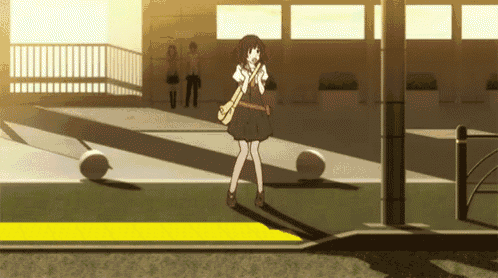 a girl in a school uniform is standing on the sidewalk