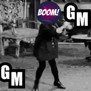 a black and white photo of a woman dancing with a purple ball on her head .