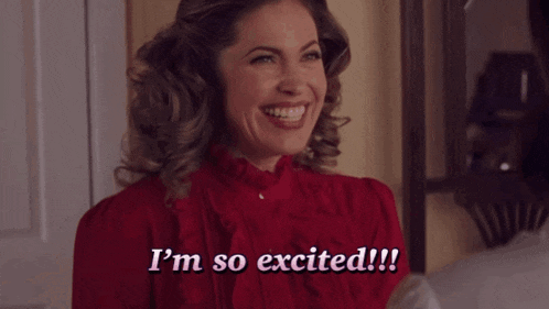 a woman in a red dress says i 'm so excited !!