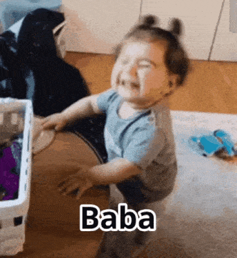 a baby is sitting on the floor and crying with the word baba above him