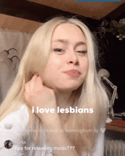 a woman with blonde hair and a caption that says i love lesbians